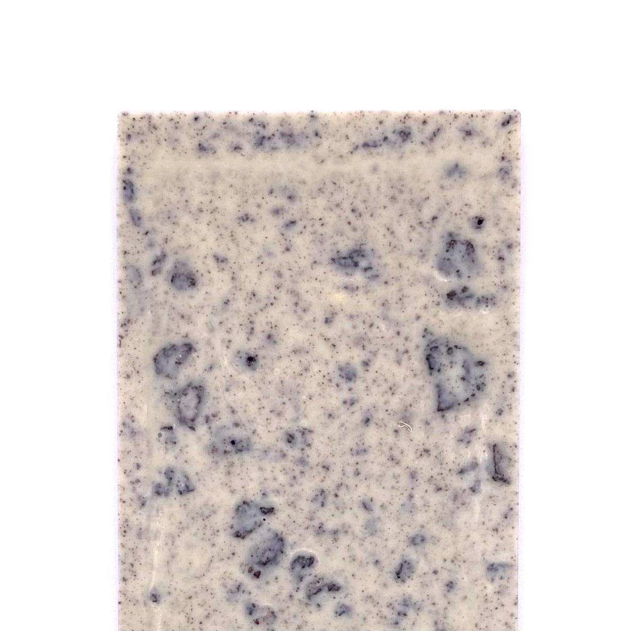The back side of the Cookies and Cream bar. You can see the chunks off cookies.
